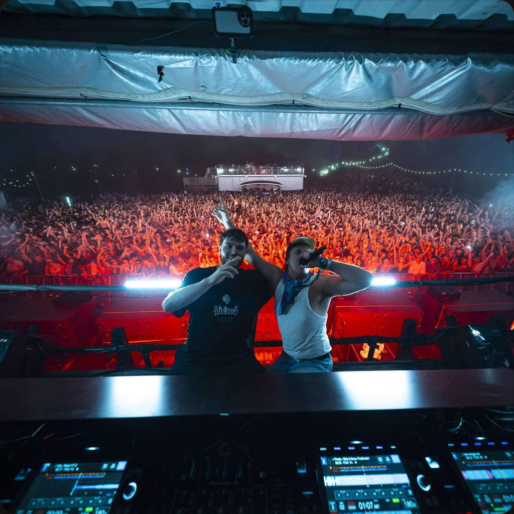 TITAN with an MC in front of a festival crowd